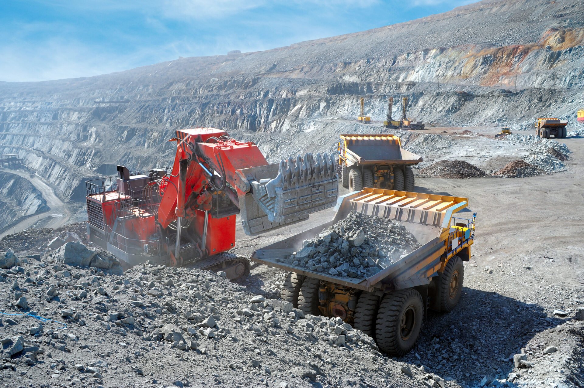Iron ore being loaded at the pit face of an open-pit mine